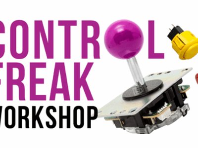 A participant assembling a colourful arcade joystick controller from a kit at a workshop table.
