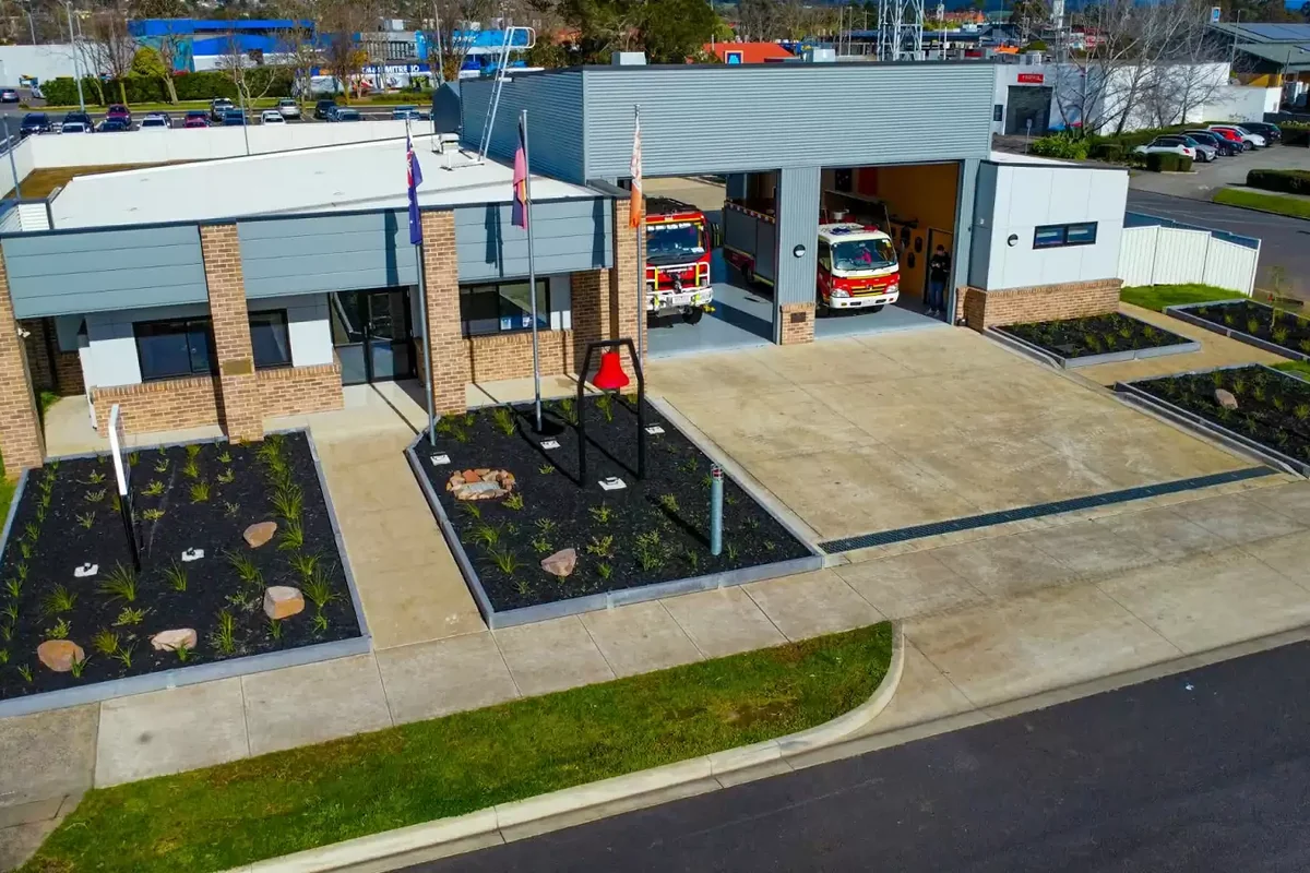 Red CFA fire appliances are parked in the motor room at Moe Fire Station.