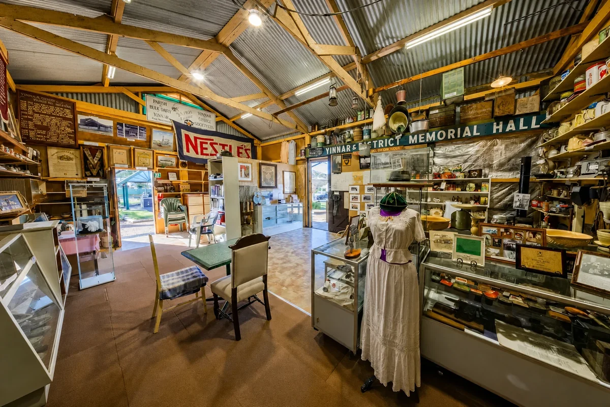 Display cases, signs, photographs, furniture and a dressed mannequin fill the Yinnar and District Historical Society and Museum.