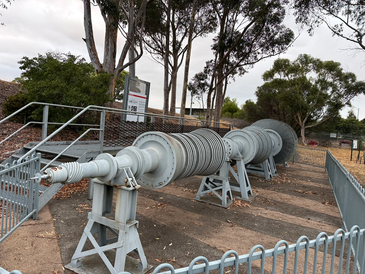 Large turbine rotor displayed outdoors at PowerWorks.